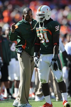 University of Miami Hurricanes head coach Randy Shannon discusses with #31 Sean Spence on the sidelines in a game against the Maryland Terrapins at...