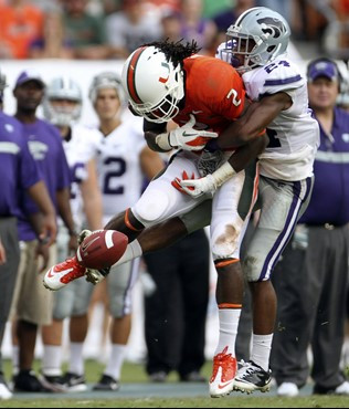 Miami's LaRon Byrd (2) is unable to catch a pass with pressure from Kansas State's Nigel Malone (24). (AP Photo/J Pat Carter)