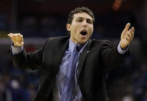 Memphis head coach Josh Pastner calls out a play against Miami during the first half of an NCAA college basketball game in Memphis, Tenn., Monday,...