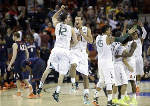 Miami players celebrate after a third-round game of the NCAA college basketball tournament against the Illinois Sunday, March 24, 2013, in Austin,...
