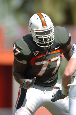 University of Miami offensive lineman Reggie Youngblood #77 blocks in a game against the Duke University Blue Devils at the Orange Bowl on September...
